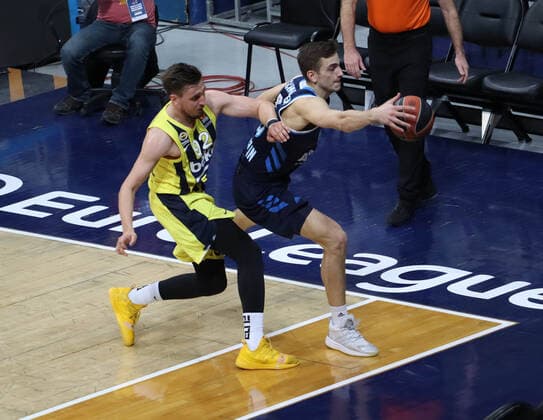 Edgar Ulanovas (L) of Fenerbahce and Marcus Eriksson (8) of Alba Berlin during the Turkish Airlines Euroleague basketball match between Fenerbahce Beko and Alba Berlin at Ulker arena in Istanbul , Turkey on February 19 , 2021. 