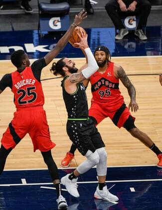 Minnesota Timberwolves guard Ricky Rubio (C) is fouled by Toronto Raptors forward Chris Boucher (L) as Toronto Raptors forward DeAndre Bembry (R) looks on during first half of the NBA, Basketball Herren, USA basketball game between the Toronto Raptors and the Minnesota Timberwolves at Target Center in Minneapolis, Minnesota, USA, 19 February, 2021. USA NBA Basketball Toronto Raptors at Minnesota Timberwolves !ACHTUNG: NUR REDAKTIONELLE NUTZUNG!  Copyright: xCRAIGxLASSIGx AME7035 20210220-637493902911692096