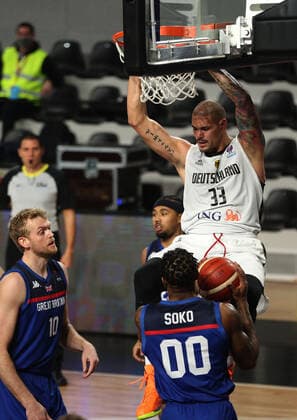 20.02.2021 Podgorica(Montenegro) Germany-Great Britain Eurobasket qualifiers men s basketball Maik Zirbes(R) Germany beside Dan Clark(L), Ovie Soko(front) Great Britain :Str