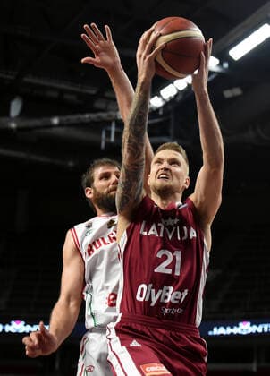 (210221) -- RIGA, Feb. 21, 2021 -- Aigars Skele (R) of Latvia goes for the bakset during their FIBA EuroBasket 2022 qualifying basketball match in Riga, Latvia, Feb. 20, 2021. (Photo by Xinhua) (SP)LATVIA-RIGA-BASKETBALL-FIBA EUROBASKET 2022-LATVIA VS BULGARIA EdijsxPalens 