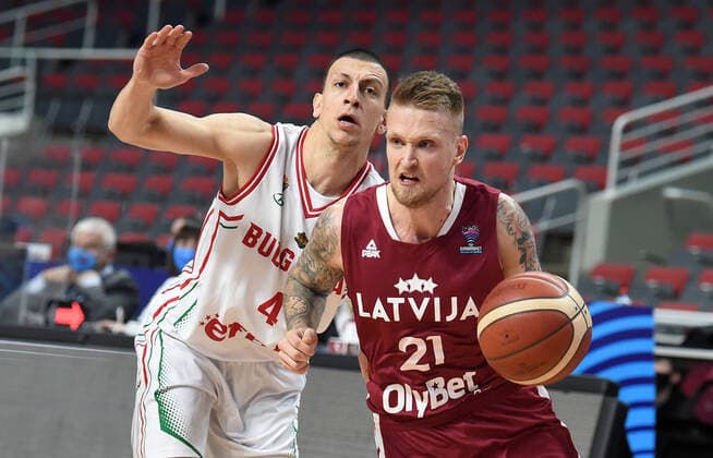(210221) -- RIGA, Feb. 21, 2021 -- Aigars Skele (R) of Latvia vies with Vasil Bachev of Bulgaria during the FIBA EuroBasket 2022 qualifying basketball match between Latvia and Bulgaria in Riga, Latvia, Feb. 20, 2021. (Photo by Xinhua) (SP)LATVIA-RIGA-BASKETBALL-FIBA EUROBASKET 2022-LATVIA VS BULGARIA EdijsxPalens 