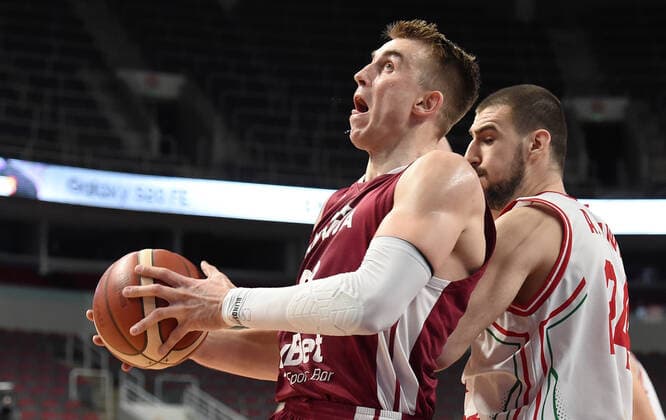 (210221) -- RIGA, Feb. 21, 2021 -- Martins Meirs (L) of Latvia vies with Andrey Ivanov of Bulgaria during the FIBA EuroBasket 2022 qualifying basketball match between Latvia and Bulgaria in Riga, Latvia, Feb. 20, 2021. (Photo by Xinhua) (SP)LATVIA-RIGA-BASKETBALL-FIBA EUROBASKET 2022-LATVIA VS BULGARIA EdijsxPalens 