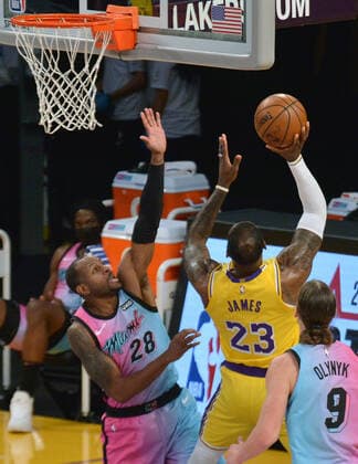 Los Angeles Lakers forward LeBron James shoots over Miami Heat forward Andre Iguodala during the second half at Staples Center in Los Angeles on Saturday, February 20, 2021. The Heat defeated the Lakers 96-94.  LAP2021022008 JIMxRUYMEN