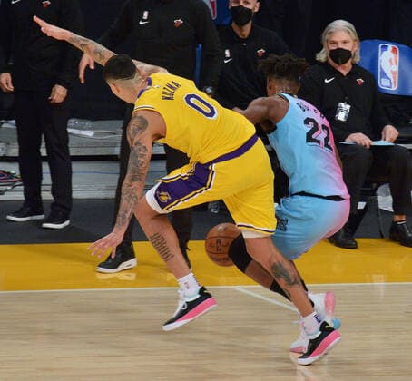 Miami Heat guard Jimmy Butler lose the ball ut of bounds under pressure from Los Angeles Lakers forward Kyle Kuzma during the second half at Staples Center in Los Angeles on Saturday, February 20, 2021. The Heat defeated the Lakers 96-94.  LAP2021022016 JIMxRUYMEN