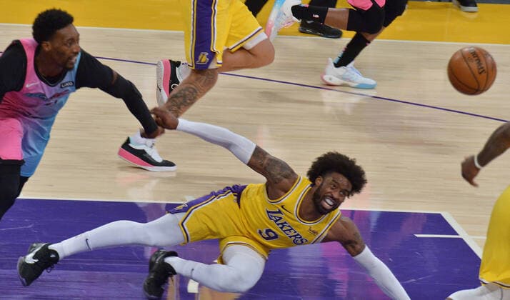 Los Angeles Lakers guard Wesley Matthews loses control of the ball as he falls to the floor under pressure from Miami Heat defenders during the second half at Staples Center in Los Angeles on Saturday, February 20, 2021. The Heat defeated the Lakers 96-94.  LAP2021022018 JIMxRUYMEN