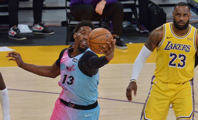 Miami Heat center Bam Adebayo secures the offensive rebound as Los Angeles Lakers forward LeBron James looks on during the second half at Staples Center in Los Angeles on Saturday, February 20, 2021. The Heat defeated the Lakers 96-94.  LAP2021022011 JIMxRUYMEN