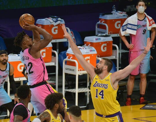Miami Heat guard Jimmy Butler shoots over Los Angeles Lakers center Marc Gasol during the first half at Staples Center in Los Angeles on Saturday, February 20, 2021. The Heat defeated the Lakers 96-94.  LAP2021022020 JIMxRUYMEN