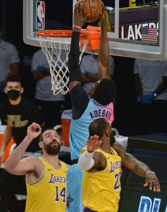 Miami Heat center Bam Adebayo scores on Los Angeles Lakers fcenter Marc Gasol and forward LeBron James during the first half at Staples Center in Los Angeles on Saturday, February 20, 2021. The Heat defeated the Lakers 96-94.  LAP2021022023 JIMxRUYMEN