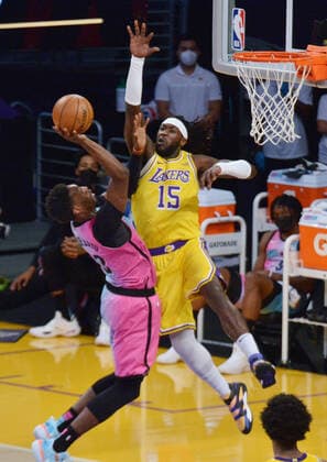 Miami Heat center Bam Adebayo scores on Los Angeles Lakers center Montrezl Harrell during the first half of the Lakers 96-94 loss at Staples Center in Los Angeles on Saturday, February 20, 2021.  LAP2021022027 JIMxRUYMEN