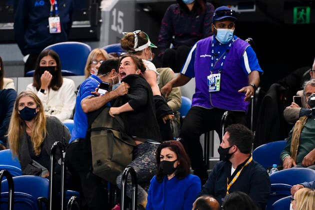 TENNIS AUSTRALIAN OPEN, Security guards remove protesters during the Men s singles finals match between Novak Djokovic of Serbia and Daniil Medvedev of Russia on Day 14 of the Australian Open at Melbourne Park in Melbourne, Sunday, February 21, 2021. ( NO ARCHIVING, EDITORIAL USE ONLY, NO USE IN BOOKS WITHOUT CONSENT MELBOURNE VIC AUSTRALIA  Copyright: xDAVExHUNTx 20210221001522075696