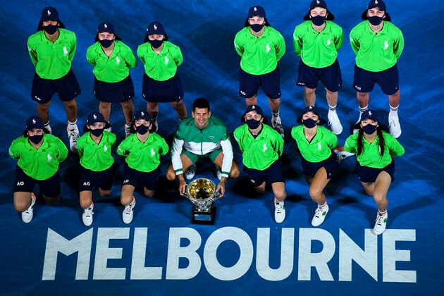 TENNIS AUSTRALIAN OPEN, Novak Djokovic of Serbia poses for photographs with the Norman Brooks Challenge Cup and ball boys after winning his Men s singles finals match against Daniil Medvedev of Russia on Day 14 of the Australian Open at Melbourne Park in Melbourne, Sunday, February 21, 2021. ( NO ARCHIVING, EDITORIAL USE ONLY, NO USE IN BOOKS WITHOUT CONSENT MELBOURNE VIC AUSTRALIA  Copyright: xJAMESxROSSx 20210221001522094458