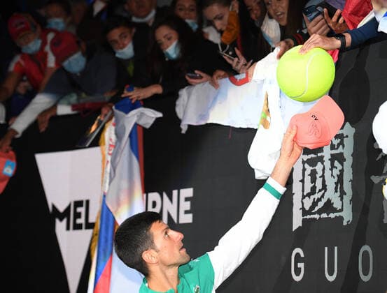 TENNIS AUSTRALIAN OPEN, Novak Djokovic of Serbia signs autographs for fans after winning his Men s singles finals match against Daniil Medvedev of Russia on Day 14 of the Australian Open at Melbourne Park in Melbourne, Sunday, February 21, 2021. ( NO ARCHIVING, EDITORIAL USE ONLY, NO USE IN BOOKS WITHOUT CONSENT MELBOURNE VIC AUSTRALIA  Copyright: xDEANxLEWINSx 20210221001522095622