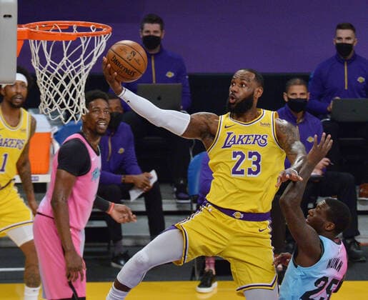 Los Angeles Lakers forward LeBron James puts up a shot in front of Miami Heat guard Kendrick Nunn during the first half of the Lakers 96-94 loss at Staples Center in Los Angeles on Saturday, February 20, 2021.  LAP2021022019 JIMxRUYMEN