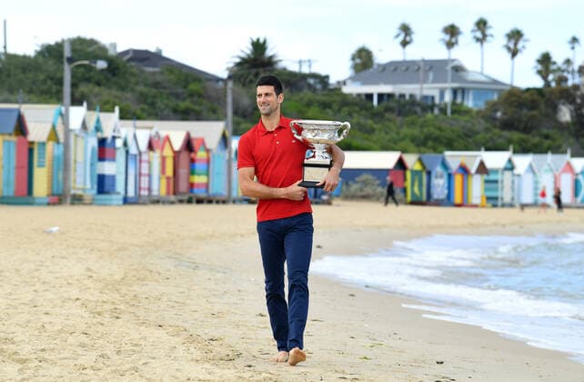 TENNIS AUSTRALIAN OPEN, Novak Djokovic of Serbia walks on Brighton Beach with the Norman Brookes Challenge Cup following his Men s singles finals win against Daniil Medvedev of Russia at the Australian Open in Melbourne, Monday, February 22, 2021. ( NO ARCHIVING, EDITORIAL USE ONLY, NO USE IN BOOKS WITHOUT CONSENT MELBOURNE VIC AUSTRALIA  Copyright: xDAVExHUNTx 20210222001522309862