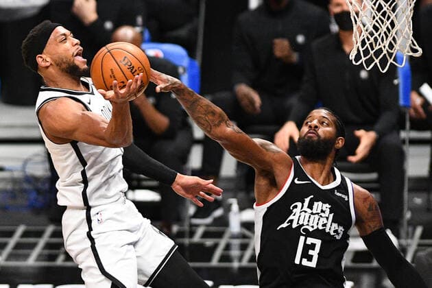 LOS ANGELES, CA - FEBRUARY 21: Brooklyn Nets Guard Bruce Brown (1) shot is blocked by Los Angeles Clippers Guard Paul George (13) during a NBA, Basketball Herren, USA game between the Brooklyn Nets and the Los Angeles Clippers on February 21, 2021 at STAPLES Center in Los Angeles, CA. The game was played without fans due to the COVID-19 pandemic. (Photo by Brian Rothmuller Icon Sportswire) NBA: FEB 21 Nets at Clippers Icon210221010