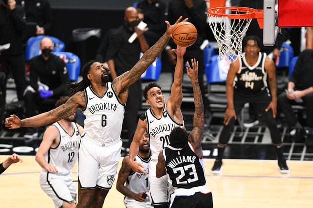 LOS ANGELES, CA - FEBRUARY 21: Los Angeles Clippers Guard Lou Williams (23) shot is blocked by Brooklyn Nets center DeAndre Jordan (6) during a NBA, Basketball Herren, USA game between the Brooklyn Nets and the Los Angeles Clippers on February 21, 2021 at STAPLES Center in Los Angeles, CA. The game was played without fans due to the COVID-19 pandemic. (Photo by Brian Rothmuller Icon Sportswire) NBA: FEB 21 Nets at Clippers Icon210221027