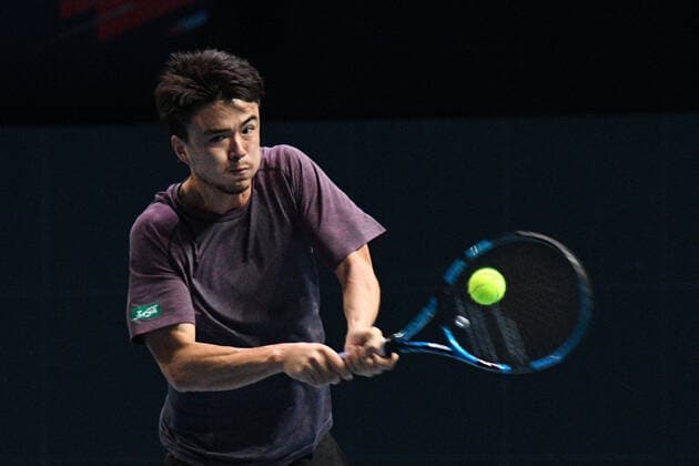 (210222) -- SINGAPORE, Feb. 22, 2021 -- Japan s Daniel Taro returns a ball during the men s singles first round match between Japan s Daniel Taro and India s Ramkumar Ramanathan at the Singapore Tennis Open in Singapore, Feb. 22, 2021. (Photo by Xinhua) (SP)SINGAPORE-TENNIS-SINGAPORE OPEN-MEN S SINGLES ThenxChihxWey 