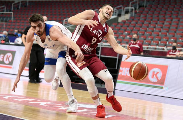 (210223) -- RIGA, Feb. 23, 2021 -- Rihards Lomazs (R) of Latvia vies with Dimitrios Katsivelis of Greece during the FIBA EuroBasket 2022 qualifying basketball match between Latvia and Greece in Riga, Latvia, Feb. 22, 2021. (Photo by Xinhua) (SP)LATVIA-RIGA-BASKETBALL-FIBA EUROBASKET 2022 QUALIFIERS-LATVIA VS GREECE EdijsxPalens 