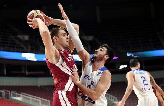 (210223) -- RIGA, Feb. 23, 2021 -- Rolands Freimanis (L) of Latvia vies with Dimitrios Katsivelis of Greece during the FIBA EuroBasket 2022 qualifying basketball match between Latvia and Greece in Riga, Latvia, Feb. 22, 2021. (Photo by Xinhua) (SP)LATVIA-RIGA-BASKETBALL-FIBA EUROBASKET 2022 QUALIFIERS-LATVIA VS GREECE EdijsxPalens 