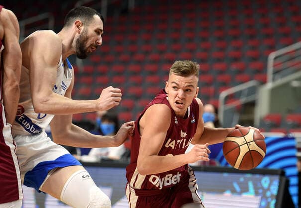 (210223) -- RIGA, Feb. 23, 2021 -- Arturs Martins Zagars (R) of Latvia competes during the FIBA EuroBasket 2022 qualifying basketball match between Latvia and Greece in Riga, Latvia, Feb. 22, 2021. (Photo by Xinhua) (SP)LATVIA-RIGA-BASKETBALL-FIBA EUROBASKET 2022 QUALIFIERS-LATVIA VS GREECE EdijsxPalens 