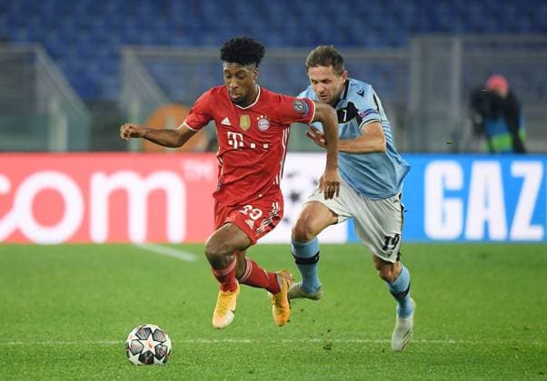 FOOTBALL CHAMPIONS LEAGUE SEASON 2020 2021 Round of 16 First leg 22 02 2021 Lazio Roma FC Bayern Muenchen Kingsley Coman left, FC Bayern Muenchen vs Senad Lulic right, Lazio Roma