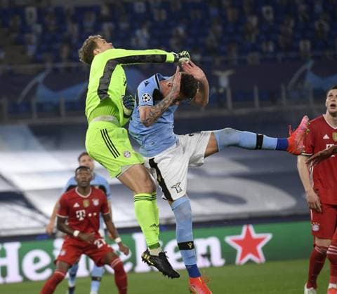 (210224) -- ROME, Feb. 24, 2021 -- Bayern Munich s Manuel Neuer (L top) vies with Lazio s Sergej Milinkovic-Savic during a UEFA Champions League round of 16 first leg football match between Lazio and Bayern Munich in Rome, Italy, Feb. 23, 2021. (Photo by Xinhua) (SP)ITALY-ROME-FOOTBALL-UEFA CHAMPIONS LEAGUE-LAZIO VS BAYERN MUNICH AugustoxCasasoli 