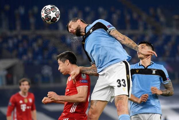FOOTBALL CHAMPIONS LEAGUE SEASON 2020 2021 Round of 16 First leg 23 02 2021 Lazio Roma FC Bayern Muenchen Francesco Acerbi r, Lazio Roma vs Robert Lewandowski l, FC Bayern Muenchen