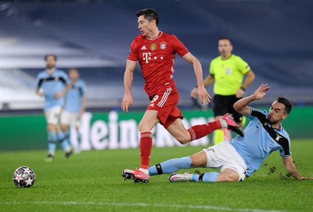 FOOTBALL CHAMPIONS LEAGUE SEASON 2020 2021 Round of 16 First leg 23 02 2021 Lazio Roma FC Bayern Muenchen Robert Lewandowski left, FC Bayern Muenchen is fouled by Gonzalo Escalante right, Lazio Roma