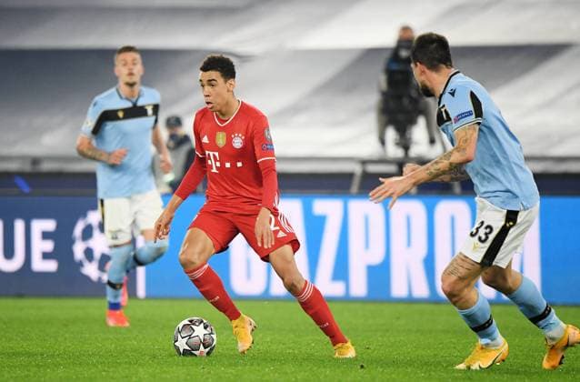 FOOTBALL CHAMPIONS LEAGUE SEASON 2020 2021 Round of 16 First leg 23 02 2021 Lazio Roma FC Bayern Muenchen Jamal Musiala left, FC Bayern Muenchen on ball against Francesco Acerbi right, Lazio Roma