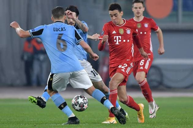 Jamal Musiala of FC Bayern Munchen vies for the ball with Luis Alberto and Lucas Leiva Pezzini of SS Lazio during the Champions League round of 16 football match between SS Lazio and Bayern Munchen at stadio Olimpico in Rome (Italy), February, 23th, 2021. Photo Andrea Staccioli Insidefoto andreaxstaccioli