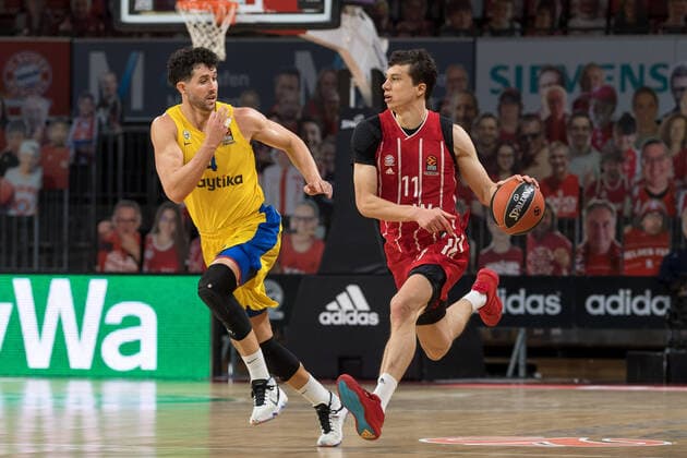 Basketball, Euroleague, FC Bayern Munich Maccabi Tel Aviv In the picture Angelo CALOIARO Maccabi Tel Aviv, 4 and Paul ZIPSER FC Bayern Munich, 16 Dribbling ball Munich Audi Dome Bayern Germany Copyright: Passion2Press.dex xMarkusxFischerx