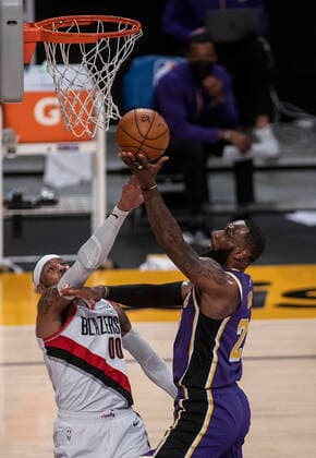 February 26, 2021, Los Angeles, California, USA: LeBron James 23 of the Los Angeles Lakers is fouled by Carmelo Anthony 00 of the Portland Trailblazers during their regular season NBA, Basketball Herren, USA game on Friday February 26, 2021 at the Staples Center in Los Angeles, California. Lakers defeat Trailblazers, 102-93. PI Los Angeles USA - ZUMAp124 20210226_zaa_p124_028 Copyright: xJAVIERxROJASx
