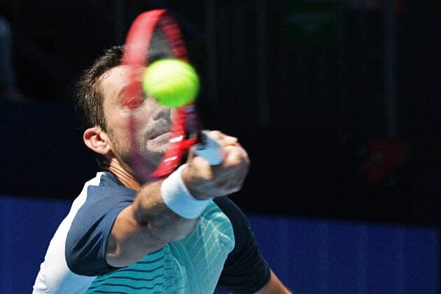 (210227) -- SINGAPORE Feb. 27, 2021 -- Marin Cilic hits a return during the men s singles semi-final match between Croatia s Marin Cilic and Australia s Alexei Popyrin at the Singapore Tennis Open tournament in Singapore on Feb. 27, 2021. (Photo by Xinhua) (SP)SINGAPORE-TENNIS-SINGAPORE OPEN-MEN S SINGLES ThenxChihxWey 