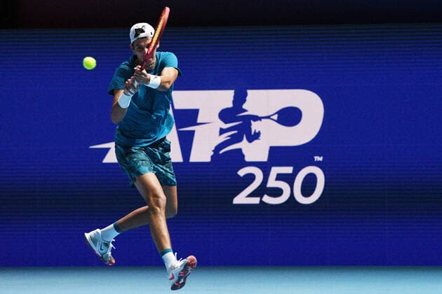 (210227) -- SINGAPORE Feb. 27, 2021 -- Alexei Popyrin hits a return during the men s singles semi-final match between Croatia s Marin Cilic and Australia s Alexei Popyrin at the Singapore Tennis Open tournament in Singapore on Feb. 27, 2021. (Photo by Xinhua) (SP)SINGAPORE-TENNIS-SINGAPORE OPEN-MEN S SINGLES ThenxChihxWey 