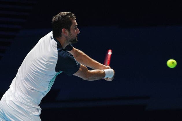 (210227) -- SINGAPORE Feb. 27, 2021 -- Marin Cilic hits a return during the men s singles semi-final match between Croatia s Marin Cilic and Australia s Alexei Popyrin at the Singapore Tennis Open tournament in Singapore on Feb. 27, 2021. (Photo by Xinhua) (SP)SINGAPORE-TENNIS-SINGAPORE OPEN-MEN S SINGLES ThenxChihxWey 