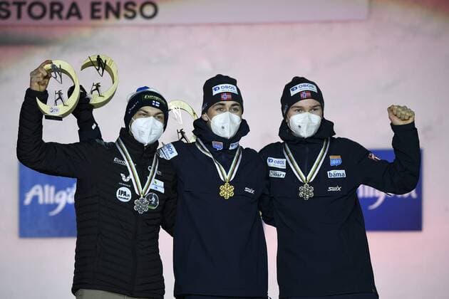 Second placed Ilkka Herola of Finland (L), winner Jarl Magnus Riiber (C) and third placed Jens Luraas Oftebro of Norway celebrate on the podium of the men s 10km individual Gundersen Nordic Combined medal ceremony event at the FIS Nordic Ski World Championships in Oberstdorf, Germany, on February 27, 2021. Oberstdorf Germany LKFTJK20210227204319DRZA  Copyright: xEmmixKorhonenx