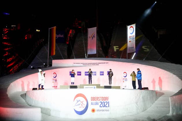 OBERSTDORF, GERMANY - FEBRUARY 27, 2021: Silver medalist Maiken Caspersen Falla of Norway, gold medalist Jonna Sundling of Sweden, and bronze medalist Anamarija Lampic (L-R center) of Slovenia during an award ceremony for the women s classic sprint event at the 2021 FIS Nordic World Ski Championships. Sergei Bobylev TASS  TS0F8076