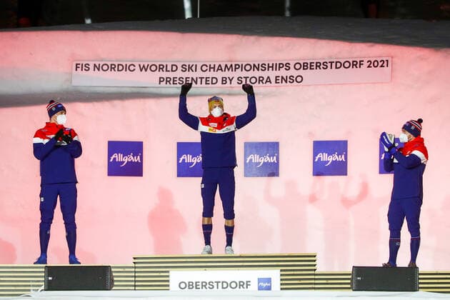 OBERSTDORF, GERMANY - FEBRUARY 27, 2021: Silver medalist Erik Valnes, gold medalist Johannes Hoesflot Klaebo, and bronze medalist Haavard Solaas Taugboel (L-R) of Norway during an award ceremony for the men s classic sprint event at the 2021 FIS Nordic World Ski Championships. Sergei Bobylev TASS  TS0F807E