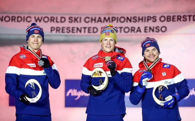OBERSTDORF, GERMANY - FEBRUARY 27, 2021: Silver medalist Erik Valnes, gold medalist Johannes Hoesflot Klaebo, and bronze medalist Haavard Solaas Taugboel (L-R) of Norway during an award ceremony for the men s classic sprint event at the 2021 FIS Nordic World Ski Championships. Sergei Bobylev TASS  TS0F8080