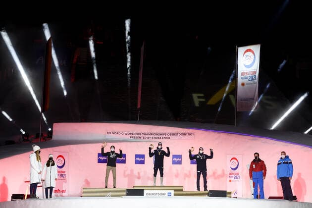 NORDIC SKIING - FIS Nordic World Ski Championships Oberstdorf 2021 OBERSTDORF,GERMANY,27.FEB.21 - NORDIC SKIING, NORDIC COMBINED - FIS Nordic World Ski Championships, men, award ceremony. Image shows the rejoicing of Ilkka Herola (FIN), Jarl Magnus Riiber and Jens Luraas Oftebro (NOR). GEPAxpictures xChristianxWalgram