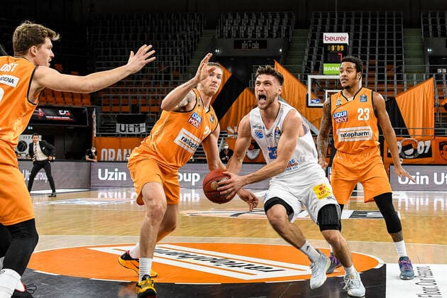 GER, BBL, ratiopharm ulm vs Syntainics MBC 27 02 2021, ratiopharm arena, Neu Ulm, GER, BBL, ratiopharm ulm vs Syntainics MBC, in picture Andreas Obst Ulm, 13 , Dylan Osetkowski Ulm, 21 , Michal Michalak Syntainics, 23 goes energetically towards the basket, Troy Caupain Ulm, 23 nordphotoxGmbHx xHafner nph00200