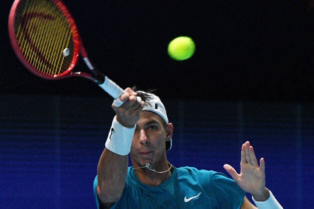 (210228) -- SINGAPORE, Feb. 28, 2021 -- Alexei Popyrin of Australia hits a return during the men s singles final against Alexander Bublik of Kazakhstan at the Singapore Tennis Open tournament in Singapore on Feb. 28, 2021. (Photo by Xinhua) (SP)SINGAPORE-TENNIS-SINGAPORE OPEN-MEN S SINGLES ThenxChihxWey 
