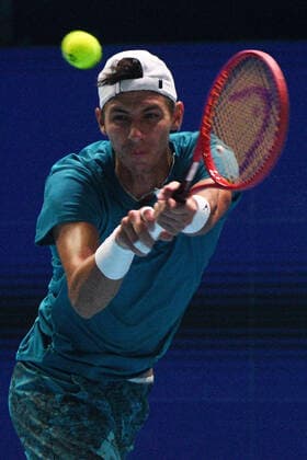 (210228) -- SINGAPORE, Feb. 28, 2021 -- Alexei Popyrin of Australia hits a return during the men s singles final against Alexander Bublik of Kazakhstan at the Singapore Tennis Open tournament in Singapore on Feb. 28, 2021. (Photo by Xinhua) (SP)SINGAPORE-TENNIS-SINGAPORE OPEN-MEN S SINGLES ThenxChihxWey 