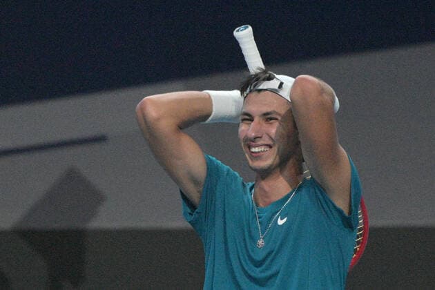 (210228) -- SINGAPORE, Feb. 28, 2021 -- Alexei Popyrin of Australia celebrates after winning the men s singles final against Alexander Bublik of Kazakhstan at the Singapore Tennis Open tournament in Singapore on Feb. 28, 2021. (Photo by Xinhua) (SP)SINGAPORE-TENNIS-SINGAPORE OPEN-MEN S SINGLES ThenxChihxWey 
