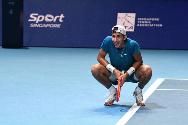 (210228) -- SINGAPORE, Feb. 28, 2021 -- Alexei Popyrin of Australia celebrates after winning the men s singles final against Alexander Bublik of Kazakhstan at the Singapore Tennis Open tournament in Singapore on Feb. 28, 2021. (Photo by Xinhua) (SP)SINGAPORE-TENNIS-SINGAPORE OPEN-MEN S SINGLES ThenxChihxWey 