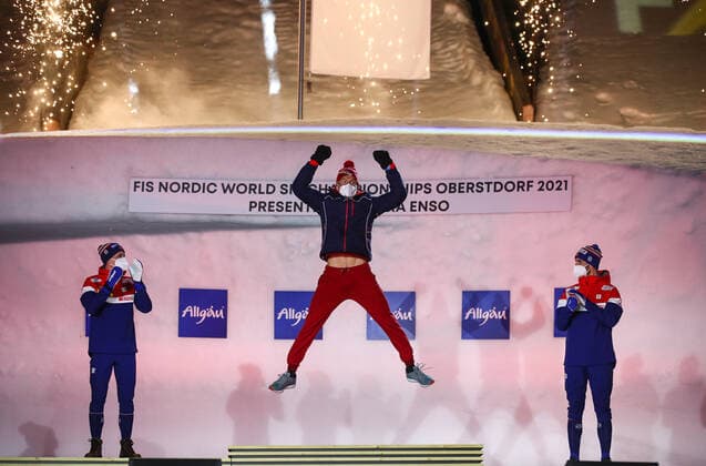 OBERSTDORF, GERMANY - FEBRUARY 28, 2021: Silver medalist Simen Hegstad Krueger of Norway, Gold medalist Alexander Bolshunov of Russia and Bronze medalist Hans Christer Holund (L-R) of Norway pose for a photograph during an award ceremony for the men s 30km skiathlon event at the 2021 FIS Nordic World Ski Championships. Sergei Bobylev TASS  TS0F8217