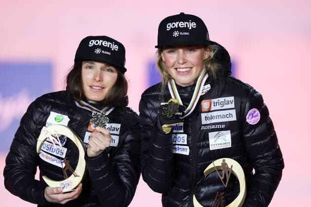 NORDIC SKIING - FIS Nordic World Ski Championships Oberstdorf 2021 OBERSTDORF,GERMANY,28.FEB.21 - NORDIC SKIING, CROSS COUNTRY SKIING - FIS Nordic World Ski Championships, sprint, team event, ladies, award ceremony. Image shows Eva Urevc and Anamarija Lampic (SLO). Keywords: medal. GEPAxpictures xChristianxWalgram