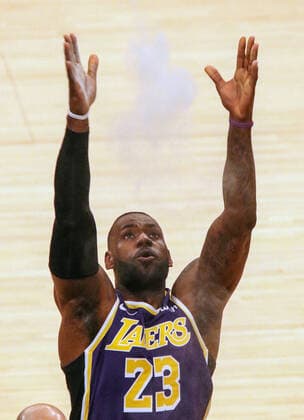 March 1, 2021, Los Angeles, California, USA: Lakers star LeBron James is criticized by soccer star, Zlatan Ibrahimovic for his social activism. FILE PHOTO: Lakers LeBron James goes through his pregame rituals prior to the start the contest as the host Los Angeles Lakers defeat the visiting Sacramento Kings on Friday November 15, 2019 at the Staples Center in Los Angeles, California. PI Los Angeles USA - ZUMAp124 20210301_zaa_p124_001 Copyright: xBURTxHARRISx