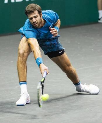 ROTTERDAM Karen Khachanov RUS in action against Stan Wawrinka SUI on the second day of the ABN AMRO World Tennis Tournament The ATP tournament in Ahoy takes place without an audience due to the corona pandemic ANP KOEN SUYK xVIxANPxSportx xxANPxIVx 428793252