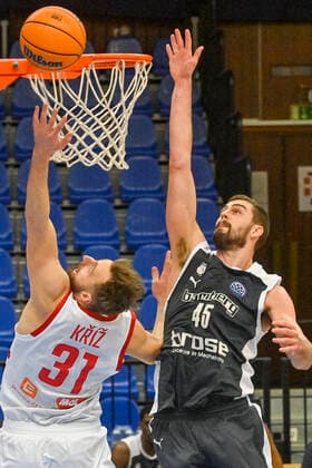 L-R Martin Kriz of Nymburk and David Kravish of Bamberg in action during the Men s Basketball Champions League 1st round group L match ERA Nymburk vs Brose Bamberg in Nymburk, Czech Republic, March 2nd, 2021. (CTKxPhoto VitxSimanek) CTKPhotoP202103021063801  VIS 011 K